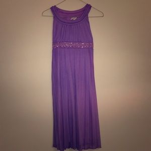 Knee length lavender dress.